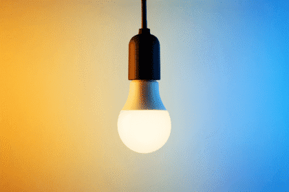 What is colour temperature illustrated with a living room split between warm lighting on the left and cool lighting on the right, showing how light tone changes ambience.