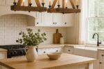Warm cottage farmhouse kitchen lighting with rustic wood chandeliers above a kitchen island